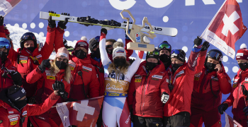 Swiss Ski Team celebrating the win with Corinne Sutter