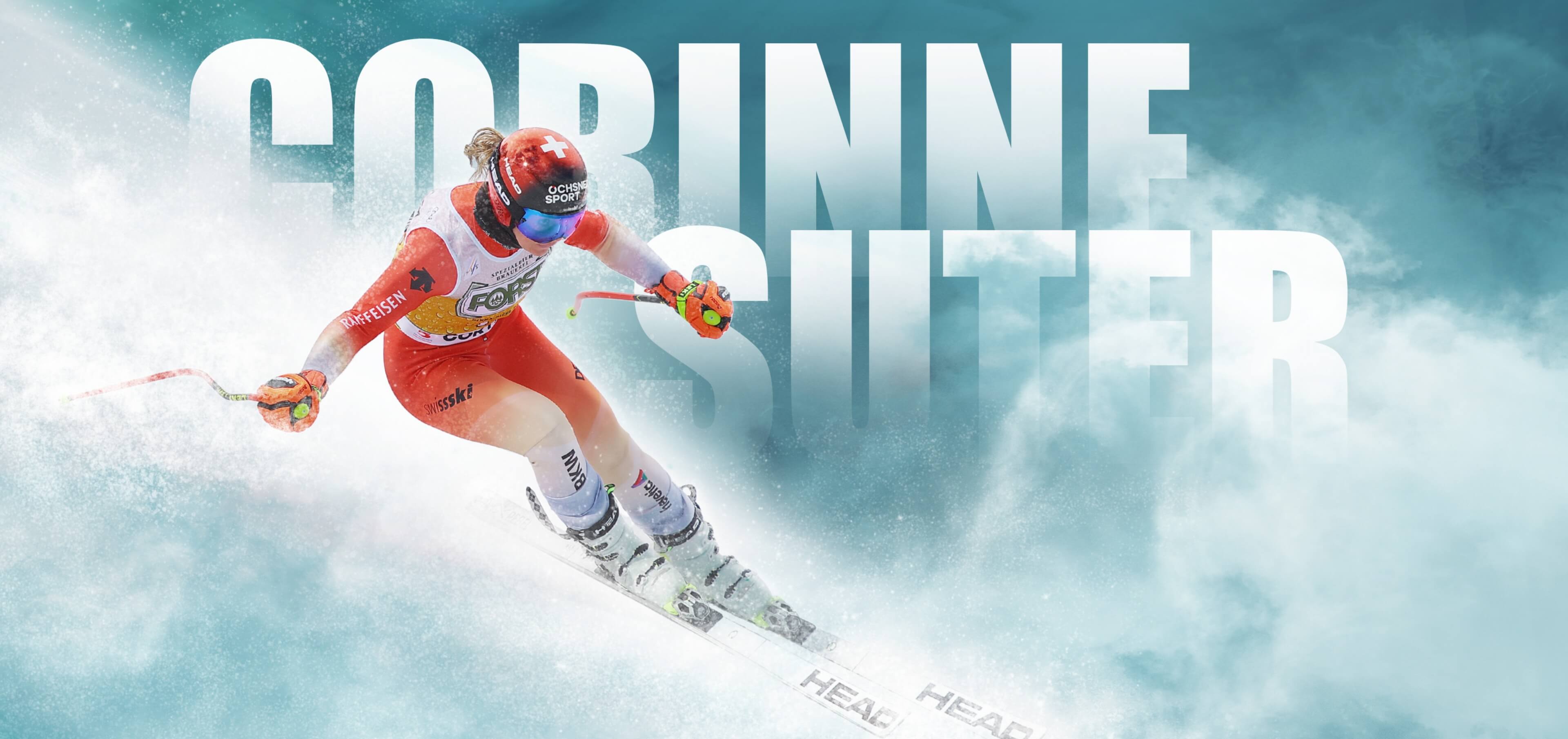 Corinne Suter during a downhill run with writing in the background